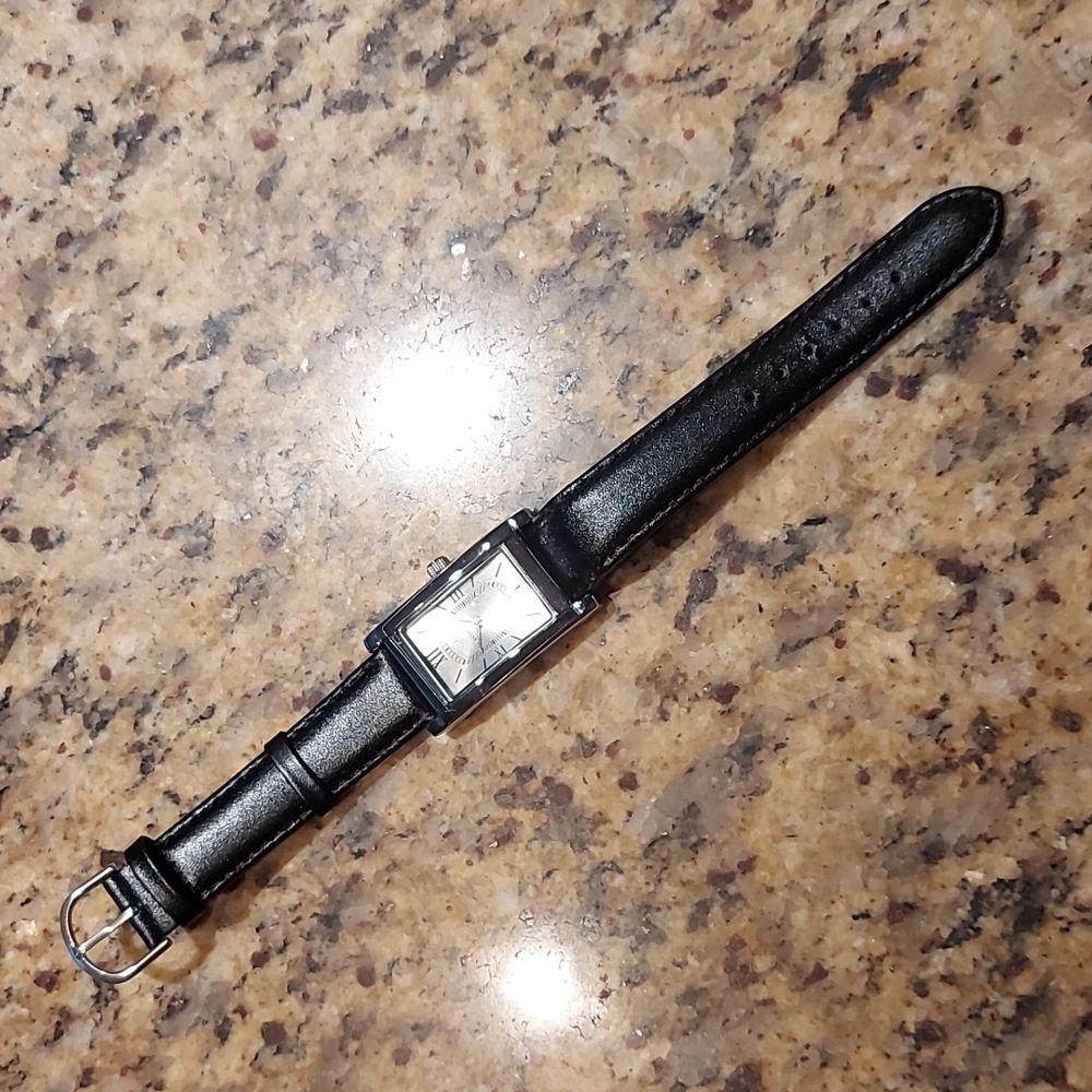 Artistry watch, leather strap.  Never worn.
